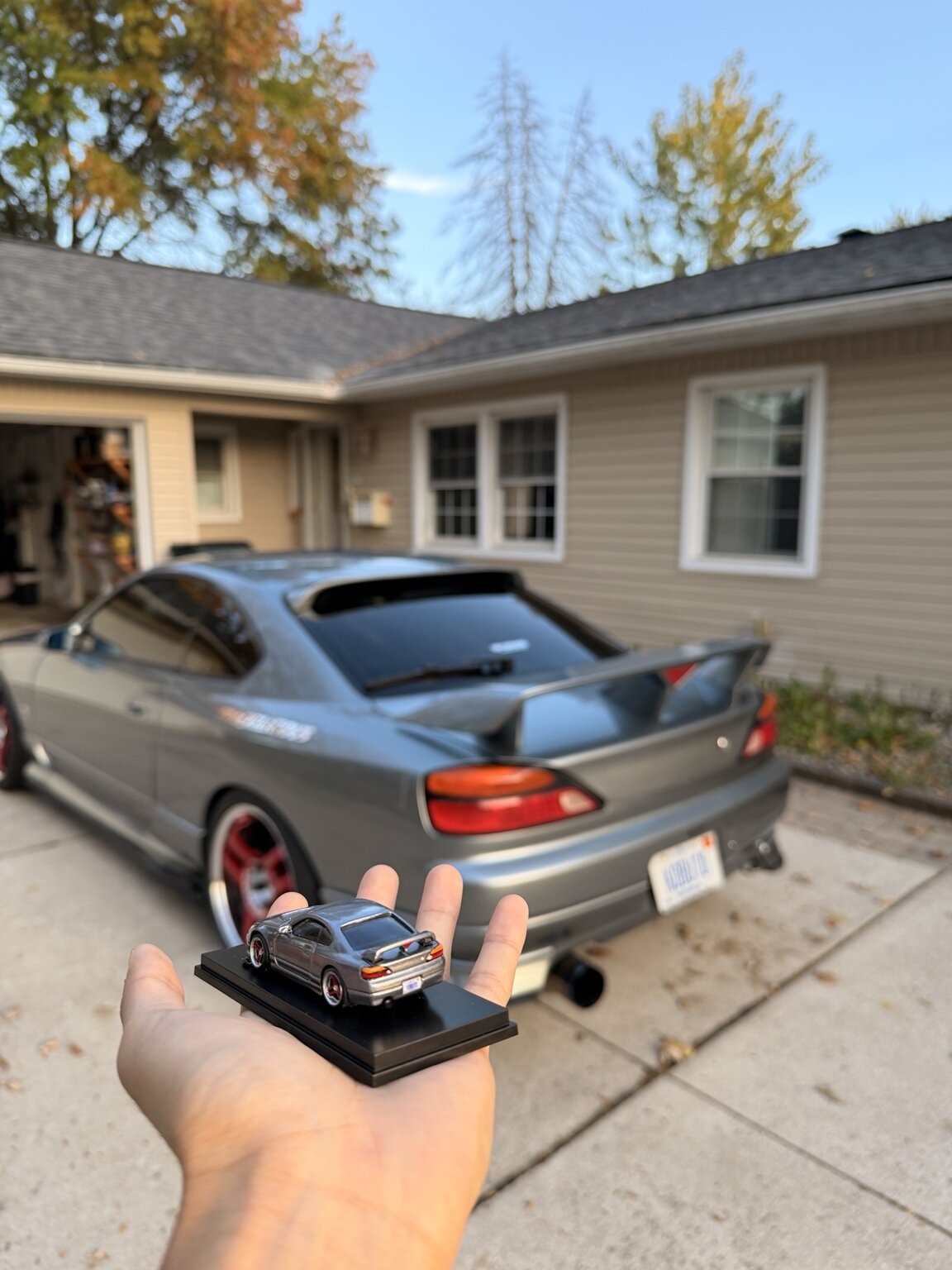 Rear three-quarter view of the miniature beside the real S15